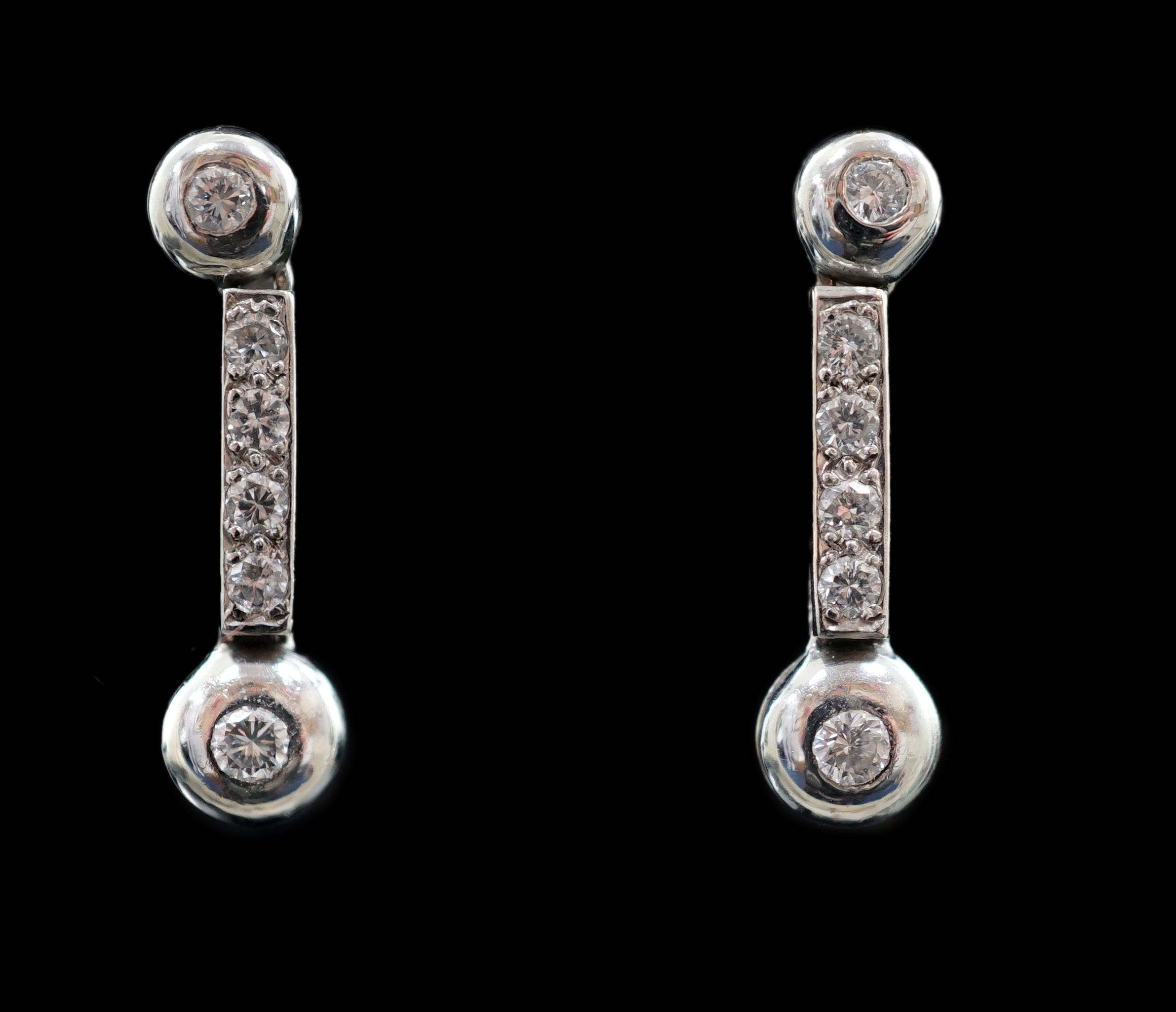 A modern pair of 18ct white gold and six stone diamond set line drop earrings
